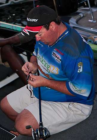 Jim Murray preps a ten inch worm just prior to launch on Day Two. Many of the pros are using larger baits to try and trigger larger bites on Old Hickory.