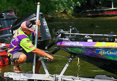 Rick Ash cinches down his boat after failing to make the cut to fish on Saturday.