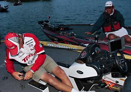 Gary Klein builds custom jigs at the dock while he and Zell Rowland visit early on Day Three of the Tennessee Triumph.