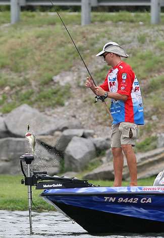 Howell flips a fish into the boat that fell victim to a shallow running crankbait.