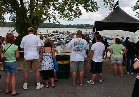 BASS fans line the bank as they watch the top 50 Elite Series pros and their co-anglers head from the dock to the weigh-in stage.