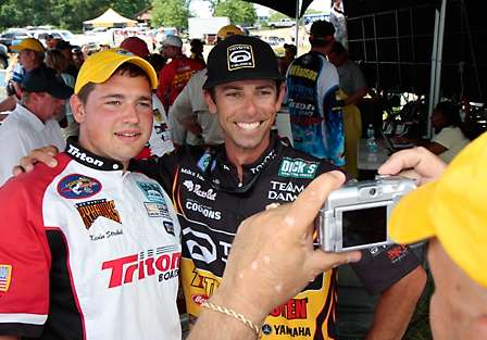 Michael Iaconelli takes a moment backstage after weighing in to pose for a photo with Kevin Strobel, a University of Tennessee College Bass competitor.
