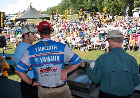 Todd Faircloth talks to emcee Keith Alan after getting his official weight from Tournament Director Trip Weldon as the fans look on.