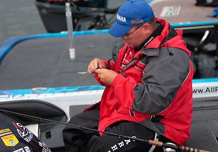 Bill Lowen takes the last moments before launch to make final bait adjustments.