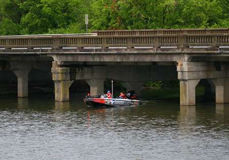 Bill Lowen idles under a bridge to his first fishing spot.