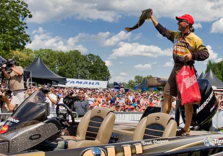Brent Chapman holds up his best fish of the day for the large crowd gathered to watch the final weigh-in of the Tennessee Triumph.