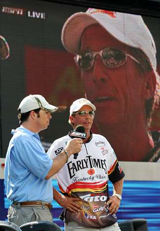 Before weighing his fish, BASS emcee Keith Alan asks Kevin Wirth about his final day of fishing on Old Hickory Lake.