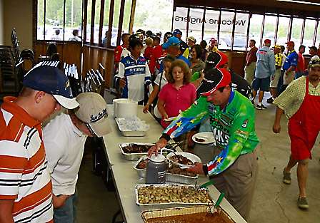 Anglers line up for barbeque before the anglers meeting inside the VFW Post 1419 Memorial Park and Museum building.