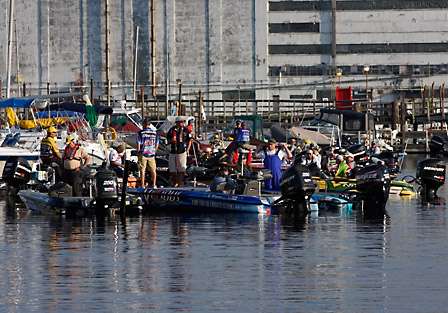 A large flotilla of bass boats gathers in the marina just prior to the National Anthem and the launch of Day One.