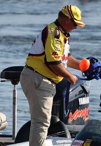 Elton Luce Jr. wraps up a windsock before weighing in on Day Two. Luce finished the day tied for 14th with 36 pounds, 10 ounces and also won the Purolator Big Bass award with a fish weighing 5 pounds, 13 ounces. 
