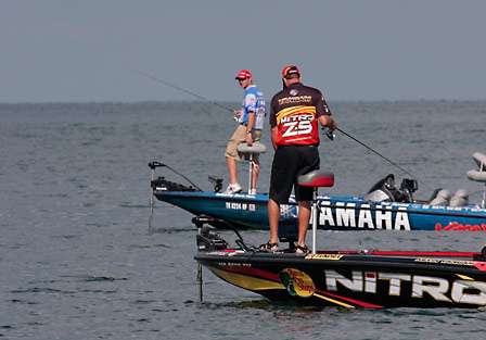 Todd Faircloth gives Kevin VanDam a glance as VanDam protects the area he started fishing this morning.