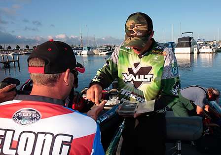 Glenn DeLong happily accepts some finesse lures from Aaron Martens prior to the start of the final day on Lake Erie.