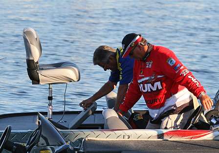 BASS officials do a quick livewell check of Matt Reed's boat. Reed starts Day Four in 11th place with 55 pounds, 1 ounce. 