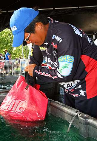 Kotaro Kiriyama takes one last look at his fish before taking the stage and winning the Empire Chase with 93 pounds, 6 ounces. 