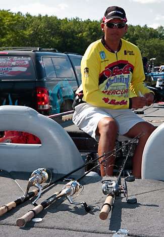 James Niggemeyer takes the line from three reels at once, saving time while readying his gear for the Champion's Choice on Oneida Lake.