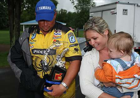Bobby Lane, wife Madeline, and Robert Jr. III, admires that trophy that was presented to Lane as the 2008 Advance Auto Parts Bassmaster Rookie of the Year. 
