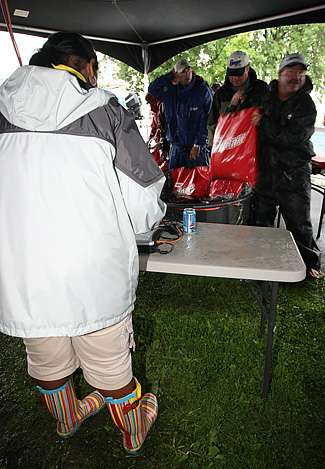 Rubber boots were the desired footwear during the soggy Day One weigh-in.