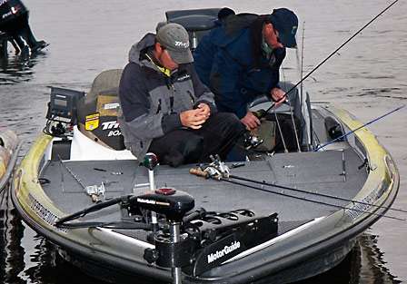 Derek Remitz and his co-angler quickly make gear adjustments before lining up for the start of Day Two.