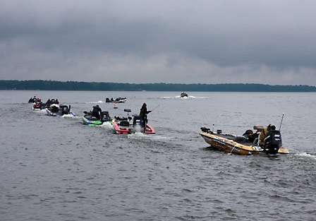 The field of contenders makes its way out onto Oneida Lake as clouds linger overhead, threatening to repeat the downpours of yesterday.