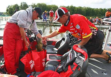John Crews loads his weigh-in bag at the end of the day. Crews finished 76th with 19 pounds, 11 ounces. 