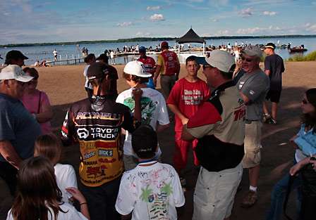 Michael Iaconelli signs autographs as he makes his way back to his boat, he weighed in 14 pounds, 4 ounces, good fro second place going into the final day of competition.
