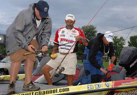 Elite winner Paul Elias watches as his two JWC anglers prepare their tackle prior to launching for the one-day tournament.
