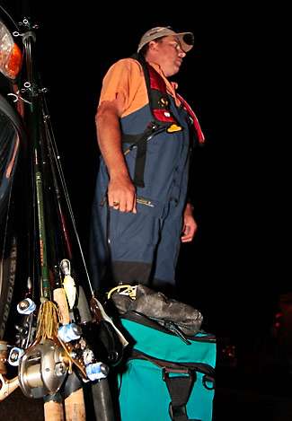 Jeff Adkins, a co-angler, waits in the parking lot for his Day One partner. 