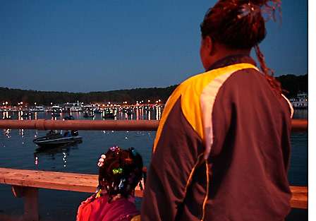 Betty Robertson (right) and her great-granddaughter, Amarrie Boyd, watch as the cove at Paris Landing fills with bass boats.