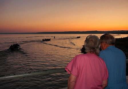 Russell and Juanita Belew enjoy another sunrise together as they watch the anglers take off from Paris Landing on Kentucky Lake.