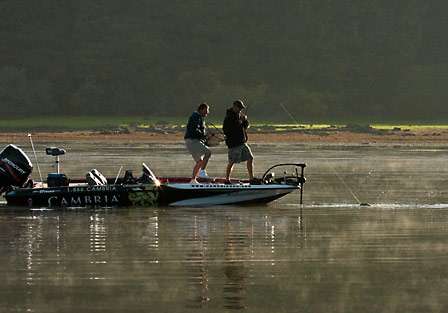 Jason Dudek hooks into a keeper bass as his co-angler, Greg Smith, goes for the net.