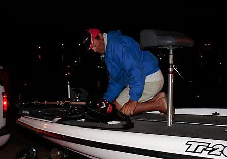 Charlie Youngers secures his trolling motor in preparation for a long run on Kentucky Lake. 
