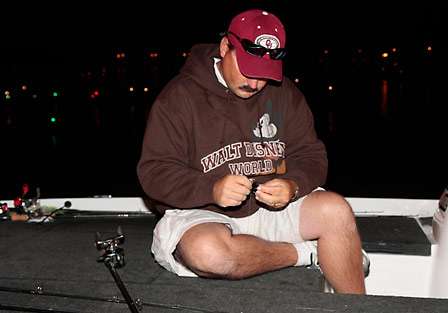 Keith Blackstone ties on a last minute bait before being launched into Kentucky Lake for the start of Day Two.