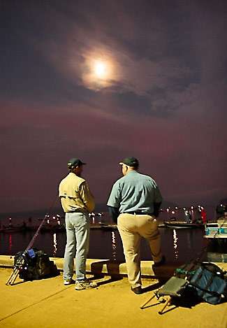 Steve Hupp (right) and Mike Sheheane wait for their pros on the docks at Lake Guntersville State Park.