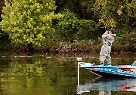 Darrell Davis takes his turn as he sets the hook on a bass that fell for a topwater presentation over heavy grass.