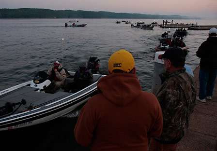 BASS fans watch as the first flight of 15 boats passes through the inspection line on the final day of the Southern Open at Lake Guntersville.