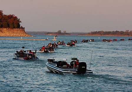 The sun begins washing over the hills surrounding Lake Texoma as the last flight of anglers make its way out onto the lake.