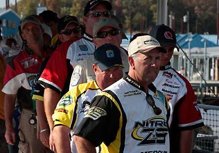 Anglers crowd into the tanks as they watch fellow competitors weigh in on stage.