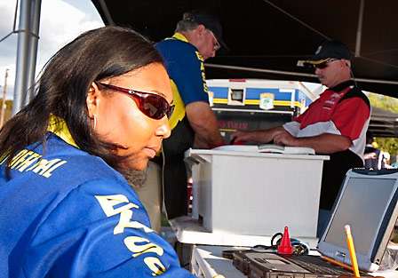 Danette Jackson, coordinator of events for BASS, enters the boat numbers and angler names into the weigh-in system before sending them to the 'bump table.'