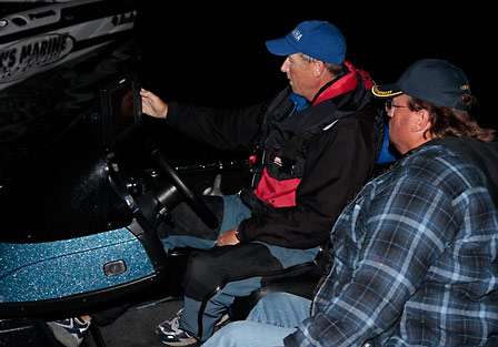 Pro Mark Burgess shows Mickey Davis, a GPS map of the areas on Lake Texoma they will be fishing.