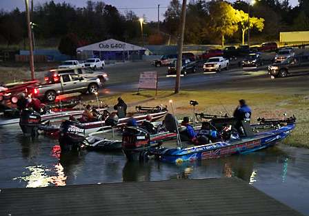 The bank and the dock begin to fill with pros waiting for their co-anglers to arrive.