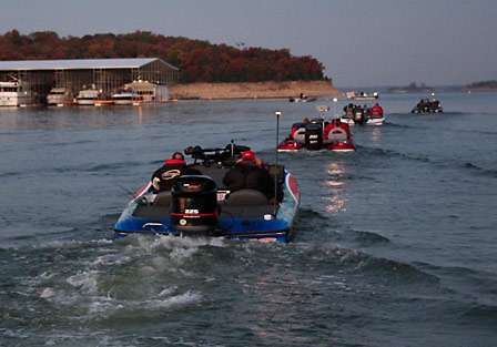Competitors in the first flight make their way out onto the calm waters of Lake Texoma, a big change from the 10- to 20-mph winds that greeted them on the fist two days.