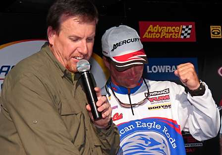 Terry Butcher, a Bassmaster Elite Series Pro, reacts to his winning weight of 15-14, bringing his tournament total to 46-8.