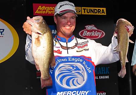 Bassmaster Elite pro Terry Butcher holds up two of the bass that helped him to the victory on a day when most anglers struggled.