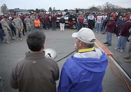Tournament director Jon Stewart (right), informs anglers that Day One has been canceled.