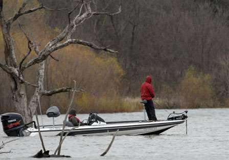 An anglers fishes the submerged trees.