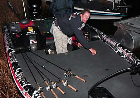 Charlie Hartley makes final adjustments to his equipment as he waits at the dock for time to launch.