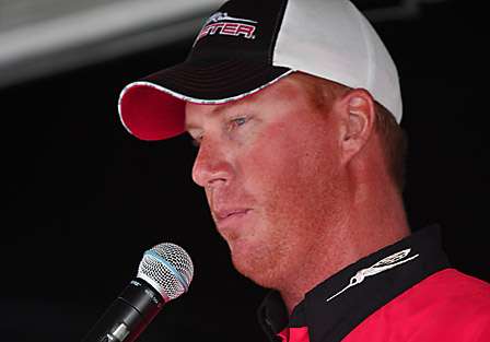 Greg Vinson explains to the fans how he was able to catch a limit of large bass.