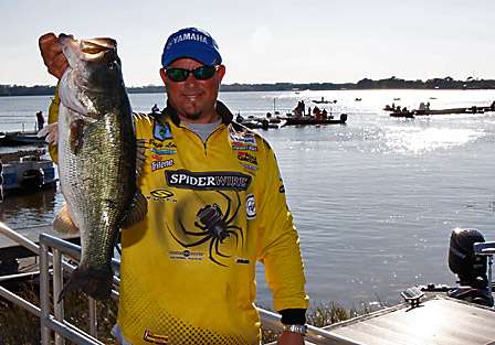 Bobby Lane holds up his largest fish of the day, one that would help boost him into fourth place at the end of Day Two.