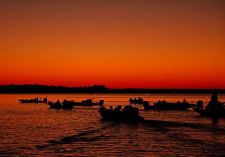 Competitors will launch in the order of the Day Two standings. The last boats to launch began to gather east of the dock as the suns glow lights up the eastern sky.