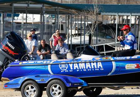 While being pulled up the boat ramp, Dean Rojas begins to immediately work on his fishing tackle in preparation for Day One of the 2009 Bassmaster Classic.